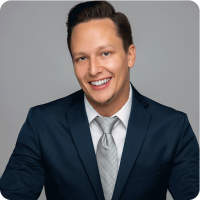 Jan Kubicka Gray Tie Blue Jacket Headshot